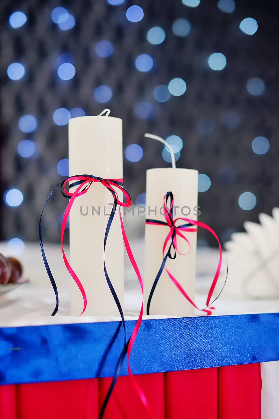 adorned decor with two candles on the background bokeh