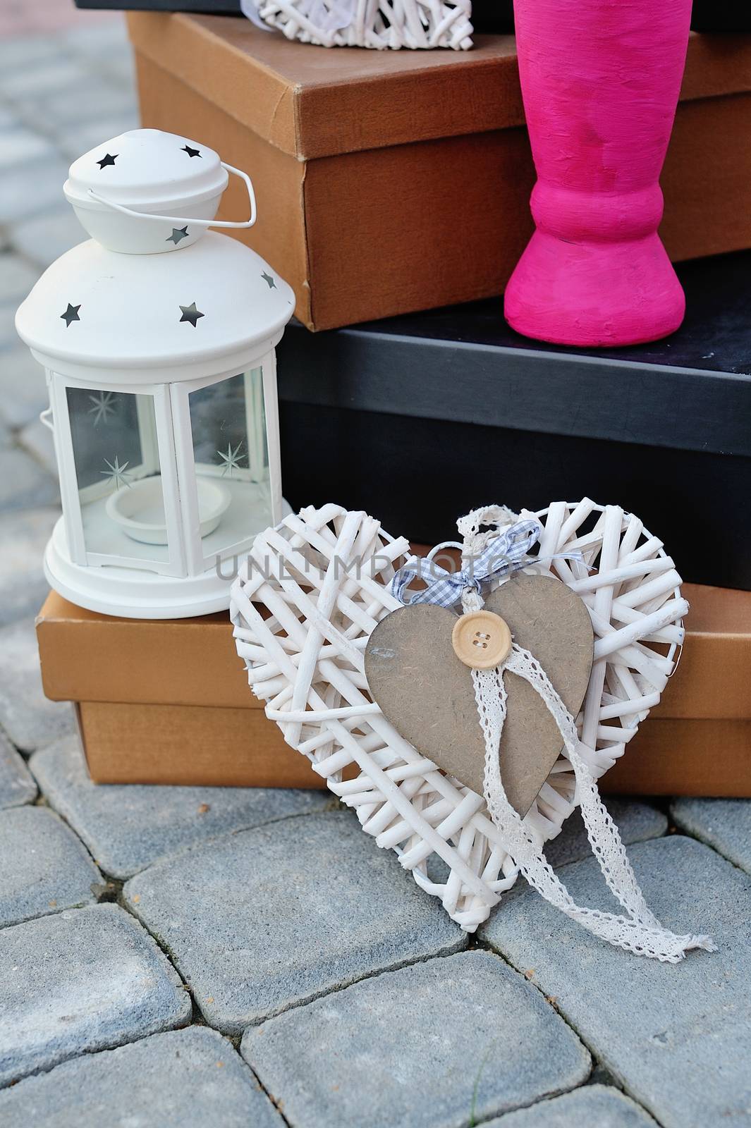 Rustic decor on a white shabby chic chair near the wall 
