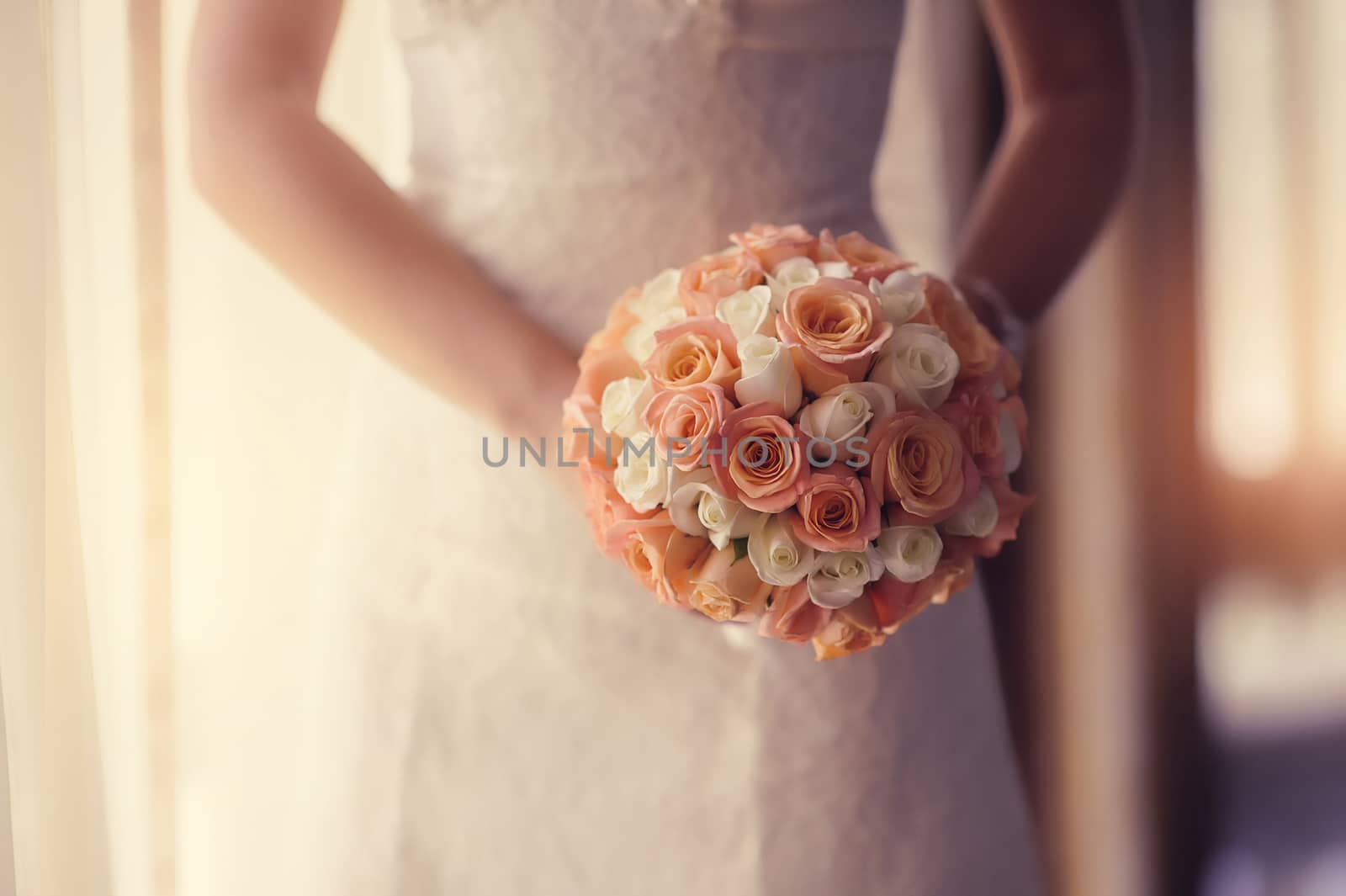 wedding bouquet at bride's hands. studio shot  by timonko