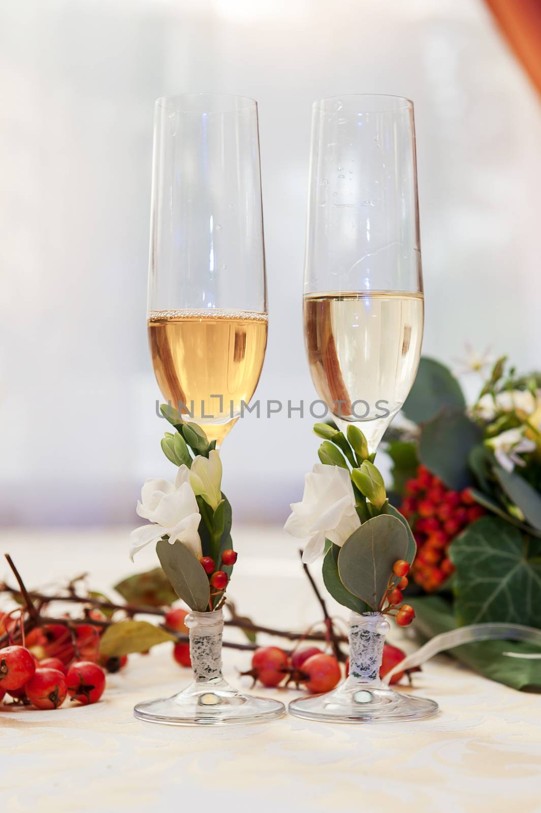 Two empty wedding champagne glasses on a table 