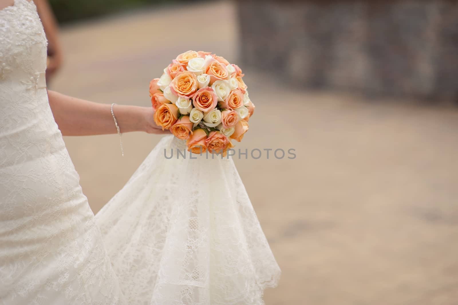 wedding bouquet at bride's hands  by timonko