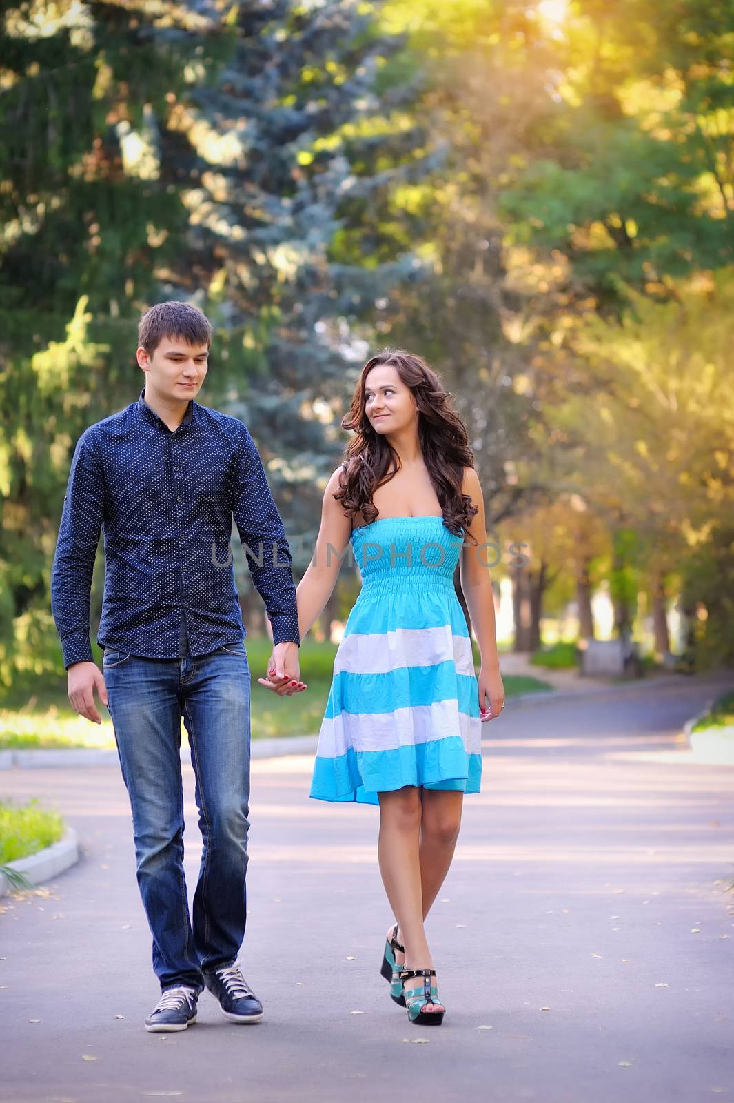 Couple in love strolling together in a beautiful park 