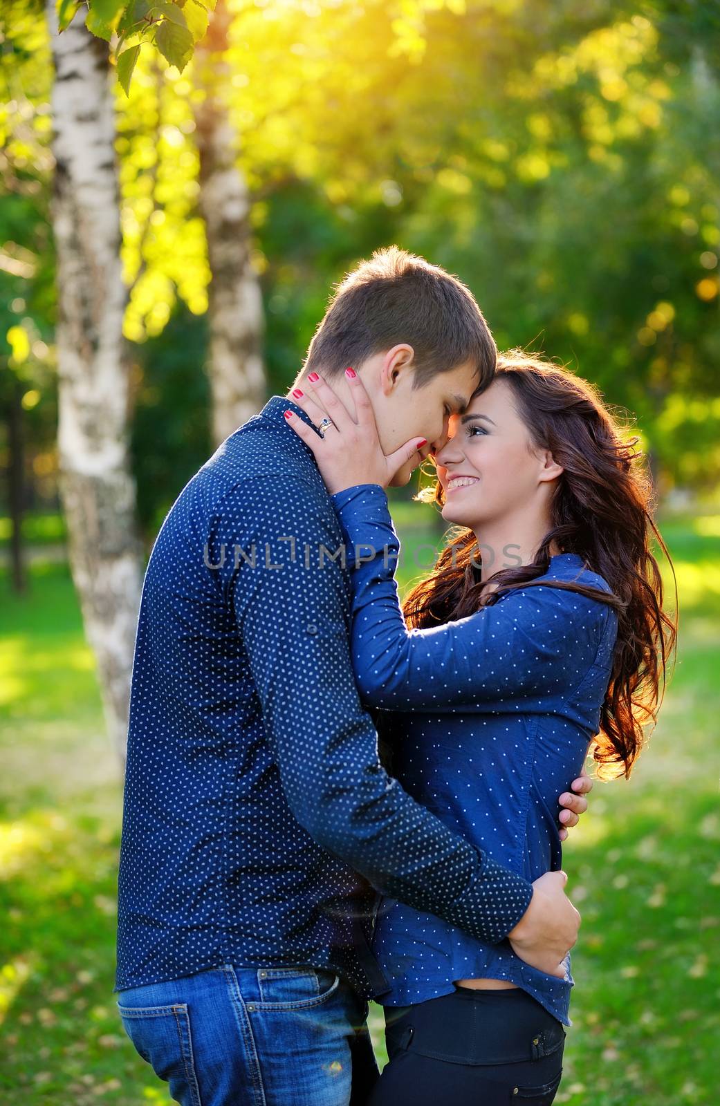 Close up portrait of young happy couple outdoors  by timonko