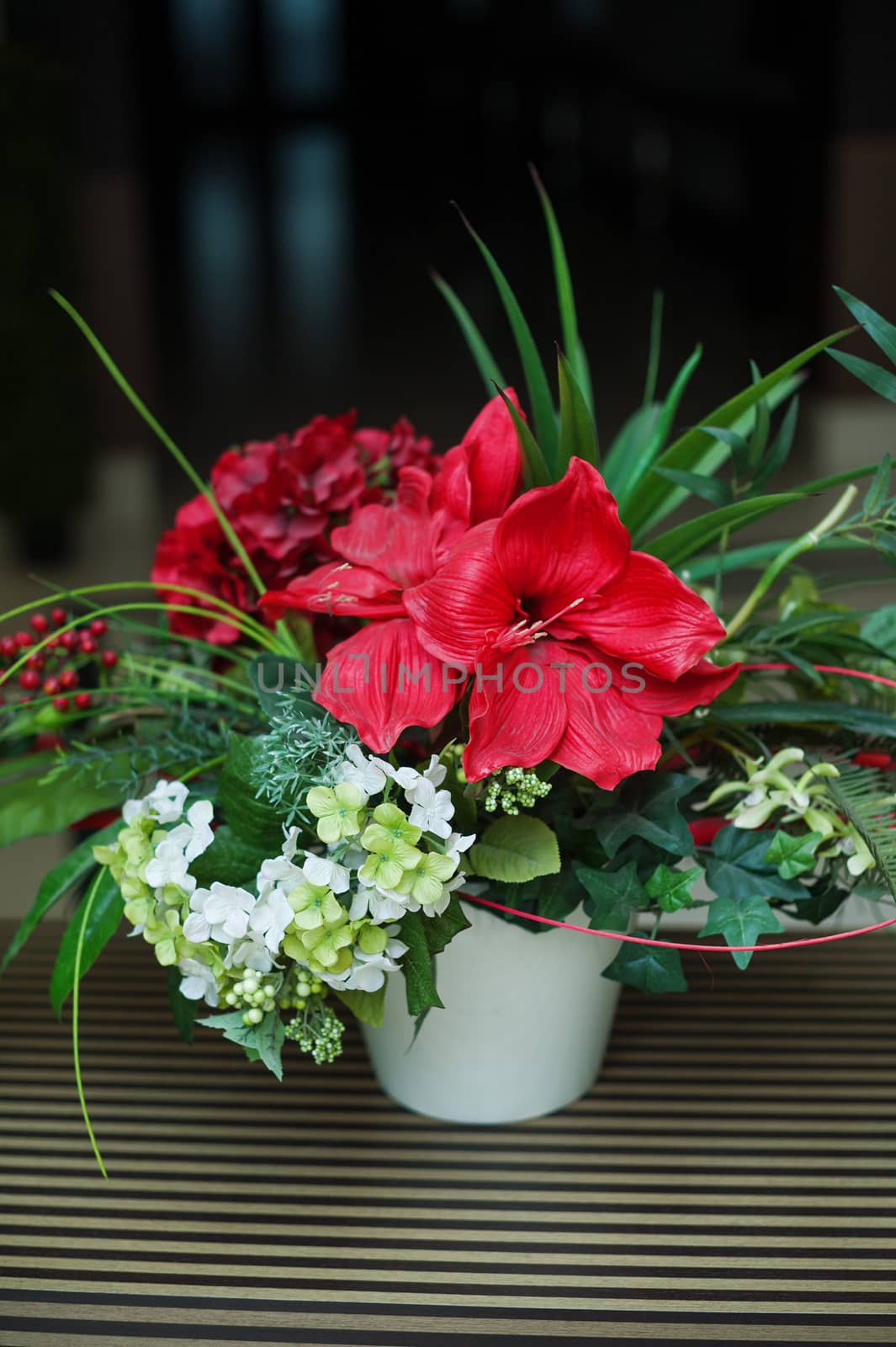 beautiful bouquet of flowers in a vase on the table by timonko