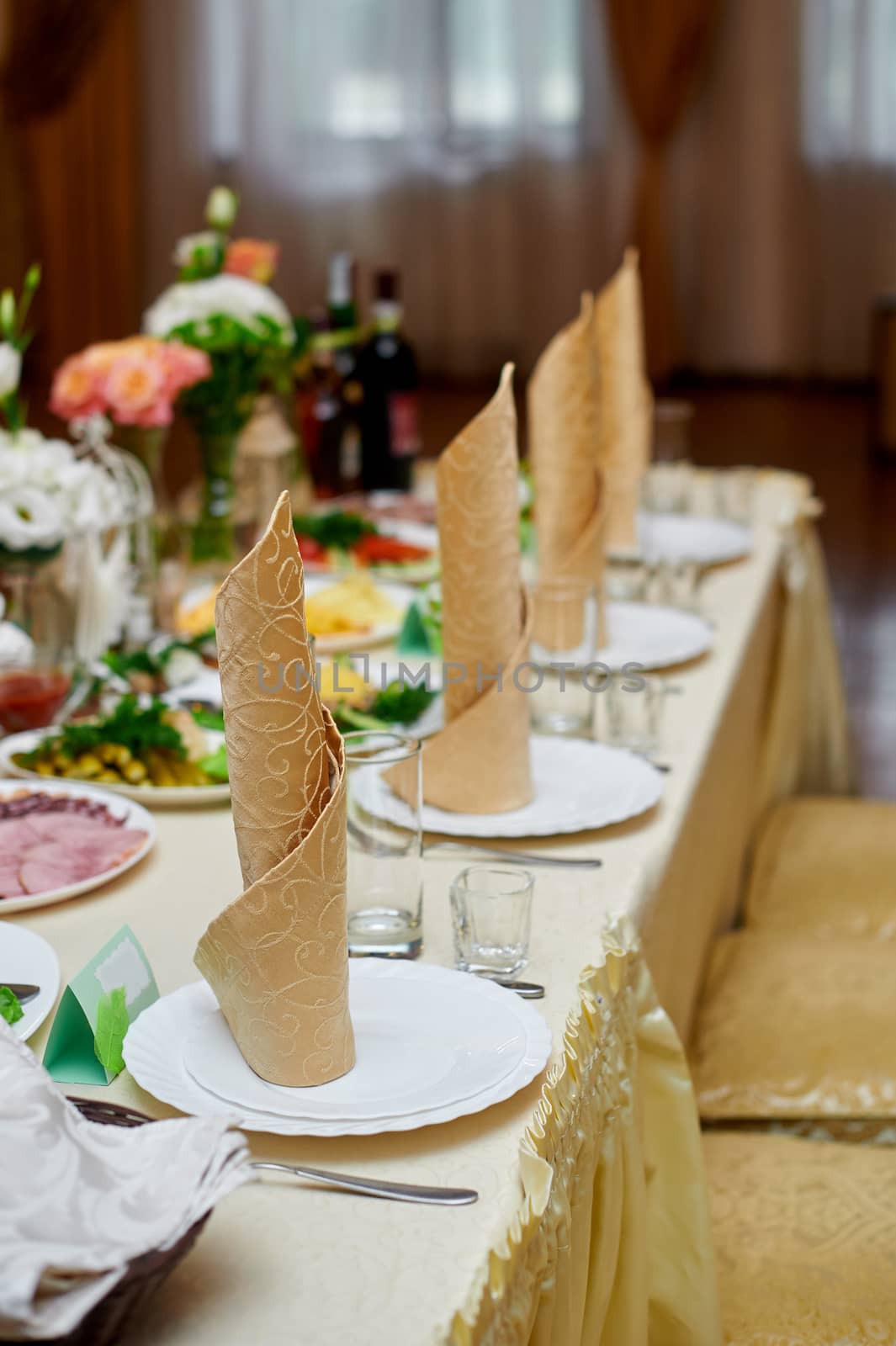 beautiful table setting for the wedding dinner in a restaurant by timonko