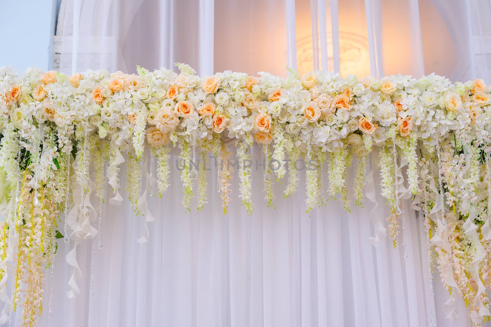 beautiful wedding Arch of white and pink roses.