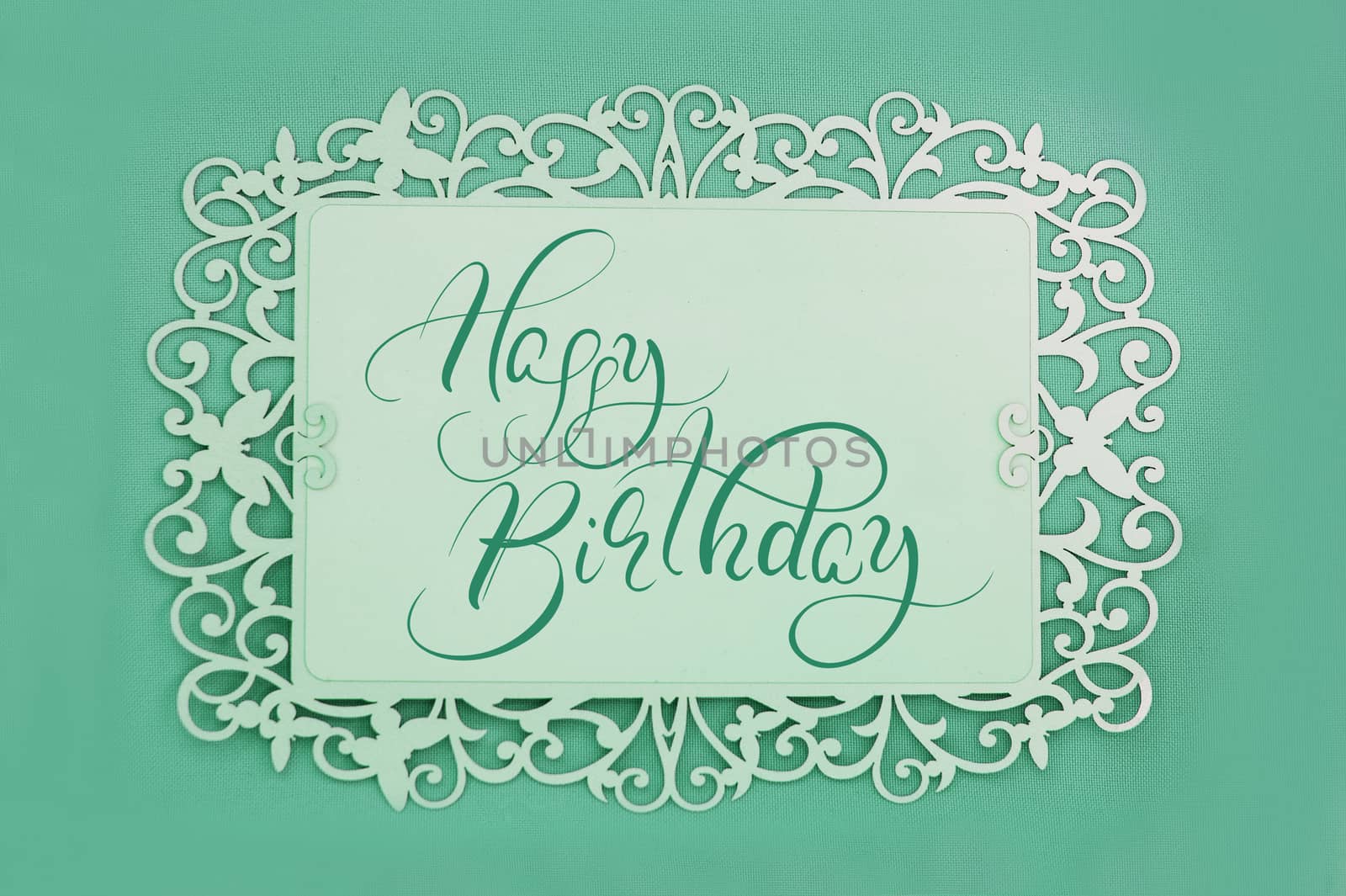 greeting card with text Happy Birthday on green background. Calligraphy lettering.