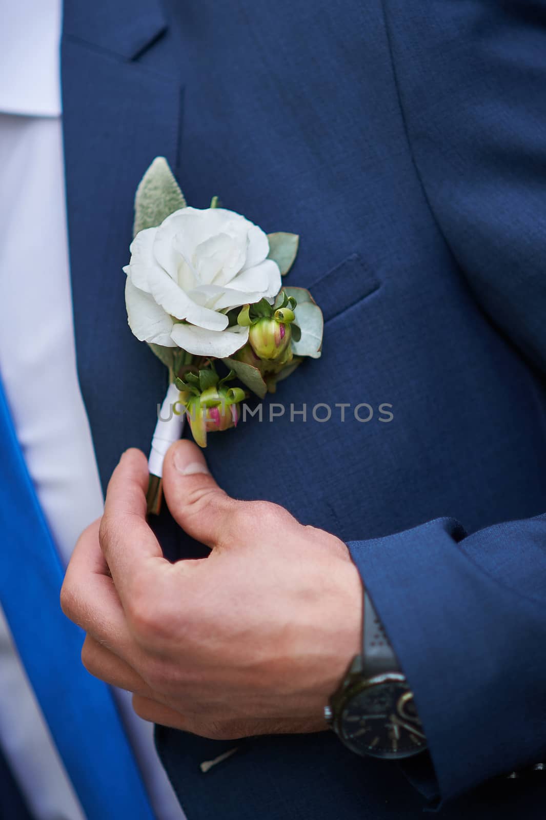 groom dress boutonniere on a jacket in wedding day