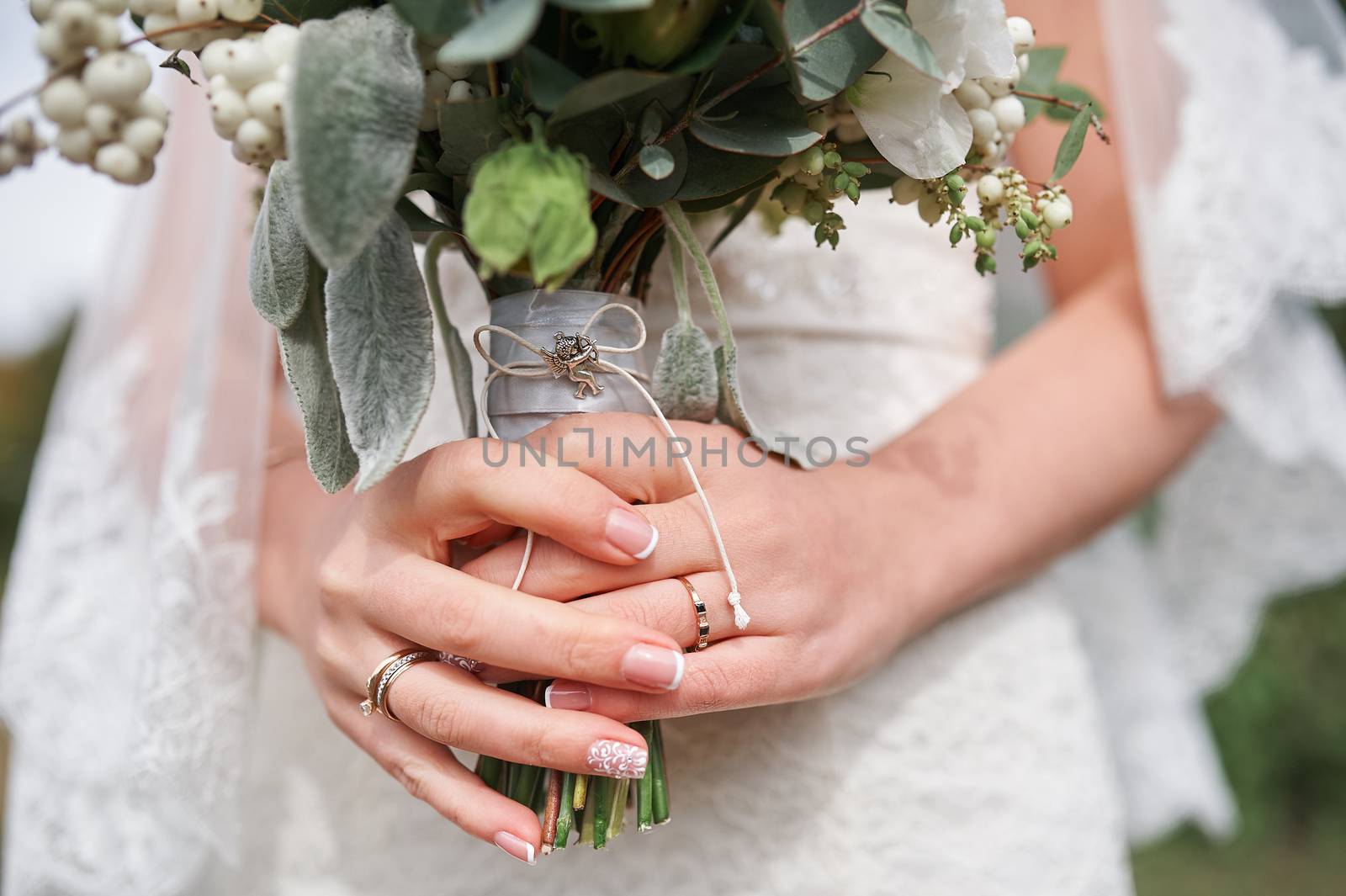 bride holding a beautiful bridal bouquet on walk