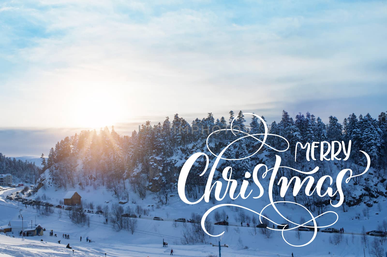 Beautiful winter landscape with snow covered trees with text Merry Christmas. Calligraphy lettering.