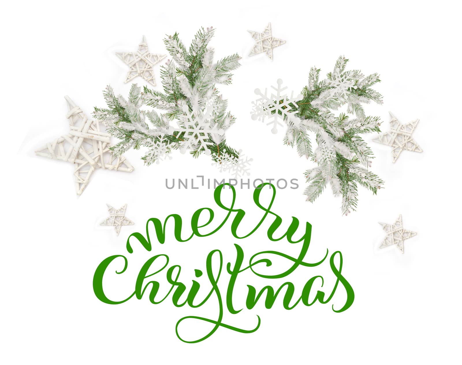 Fir branches in the snow on a white background and text of Merry Christmas. lettering calligraphy.