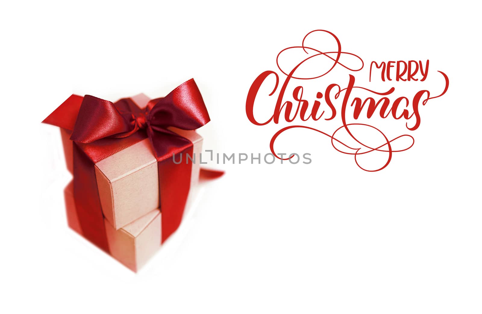 Gift boxes with brown bow on a white background and text Merry Christmas. lettering calligraphy.