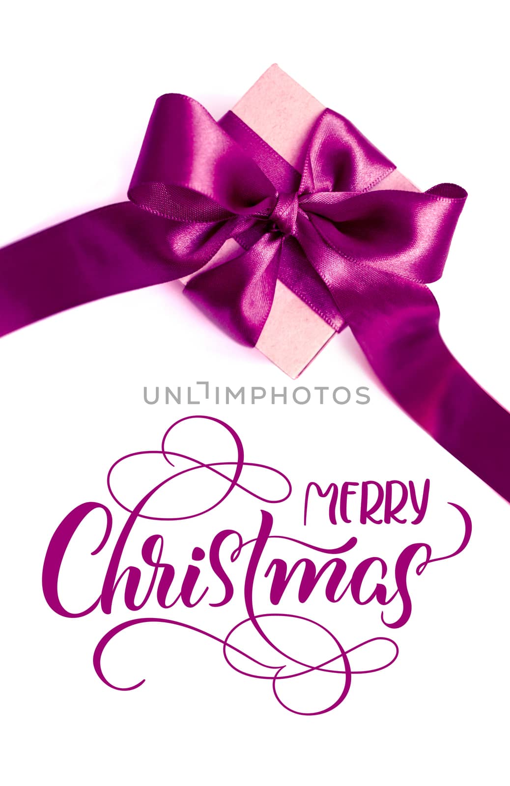 Gift box with purple bow on a white background and text Merry Christmas. lettering calligraphy.