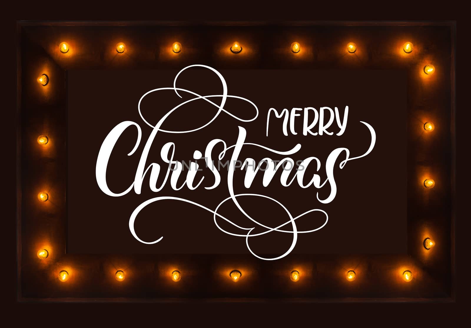 dark background with light bulbs and Merry Christmas text. Calligraphy lettering.