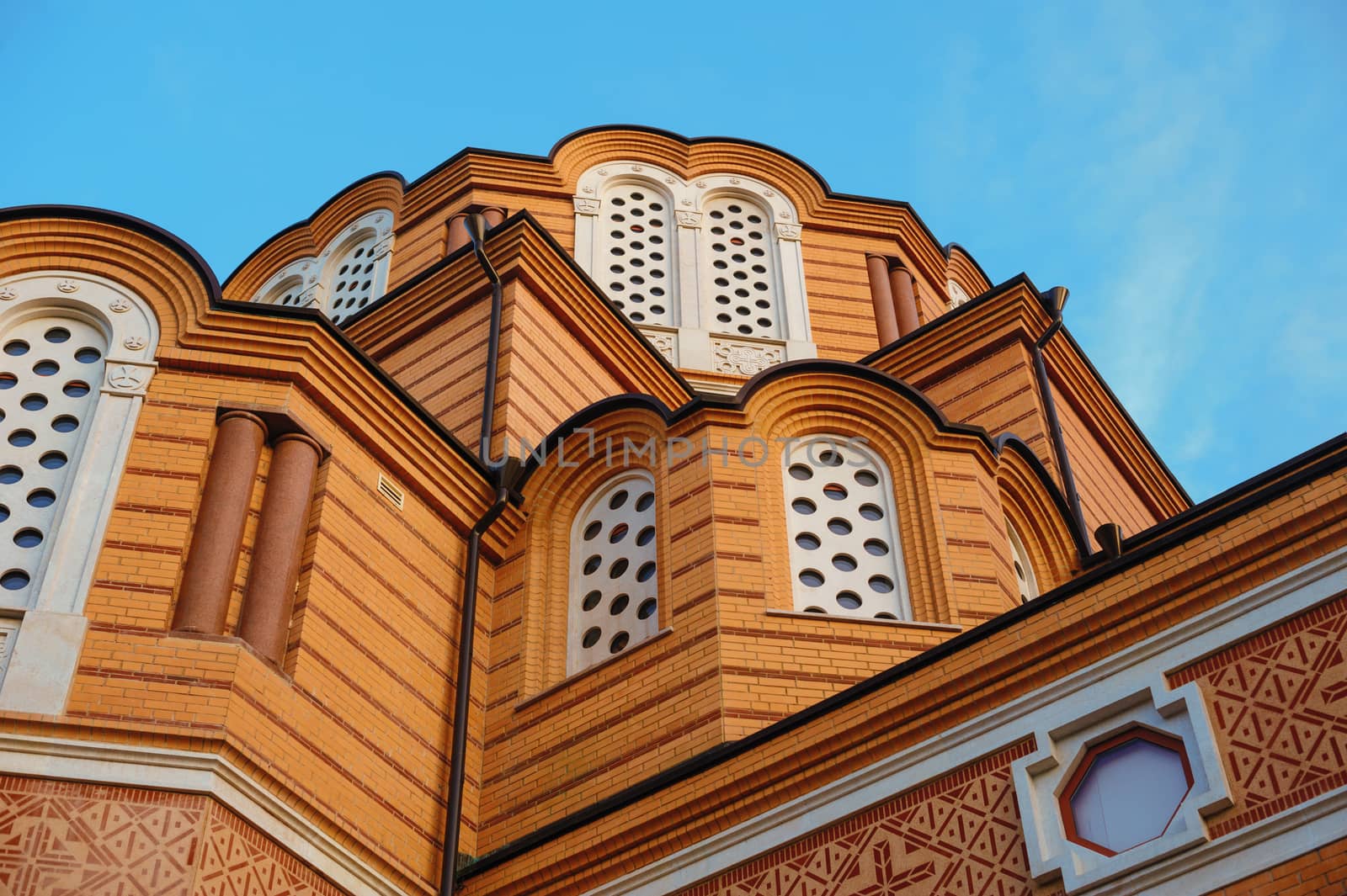 beautiful wooden multi-storey building on the sky background.