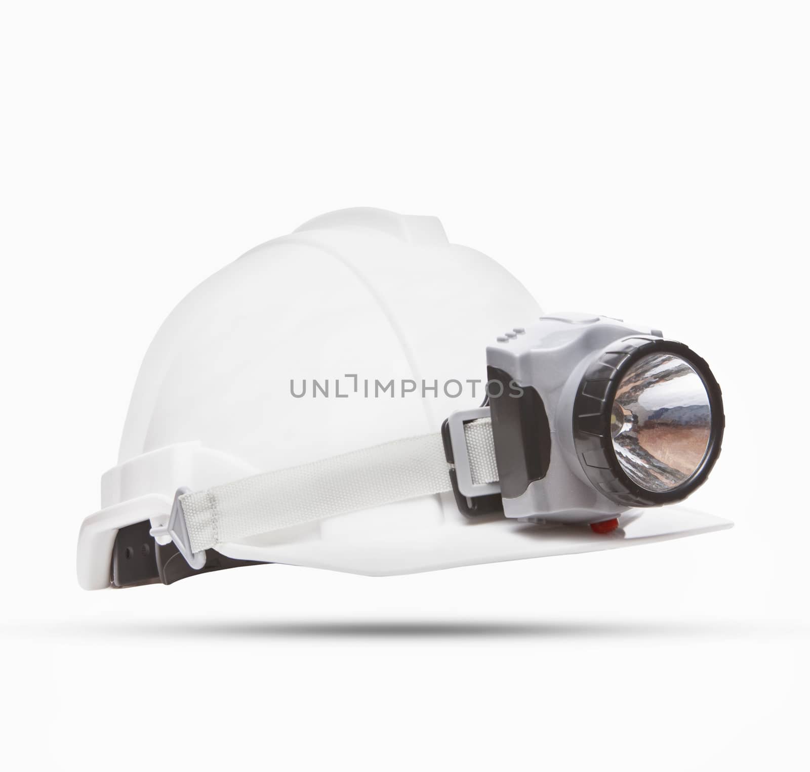 white mining safety helmet with light lamp isolated background by khunaspix