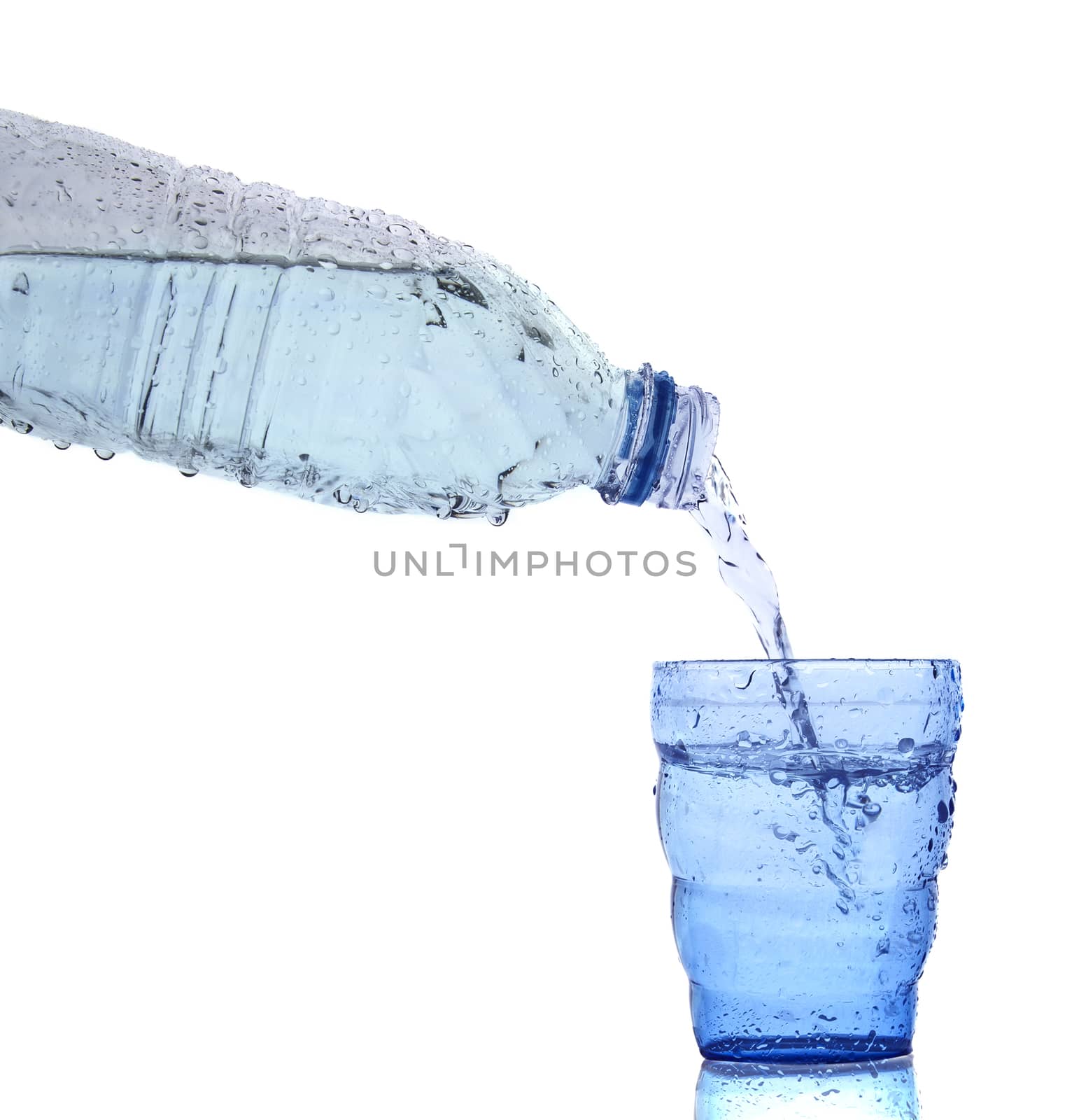 freshness cool and clean drinking water pouring to blue glass is by khunaspix
