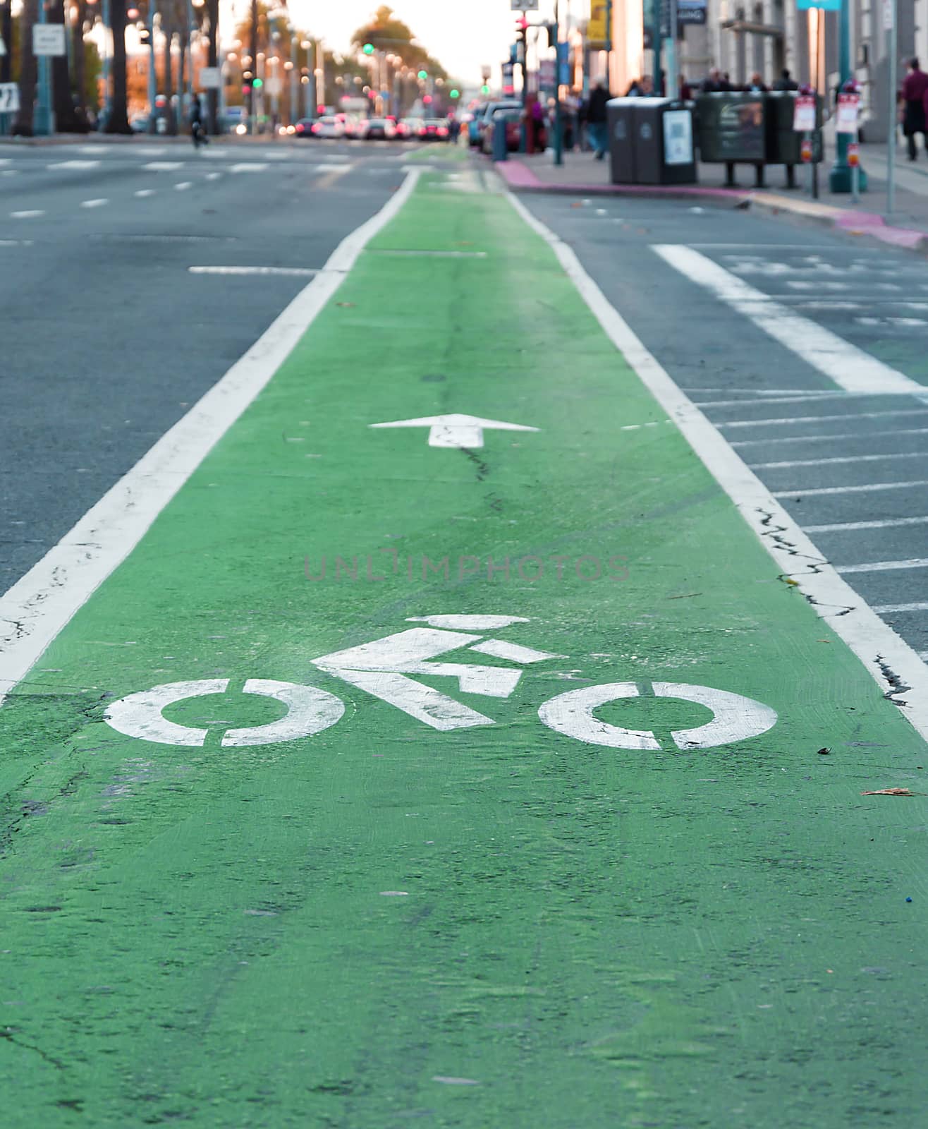 bike lane painted in green and traffic jam in background