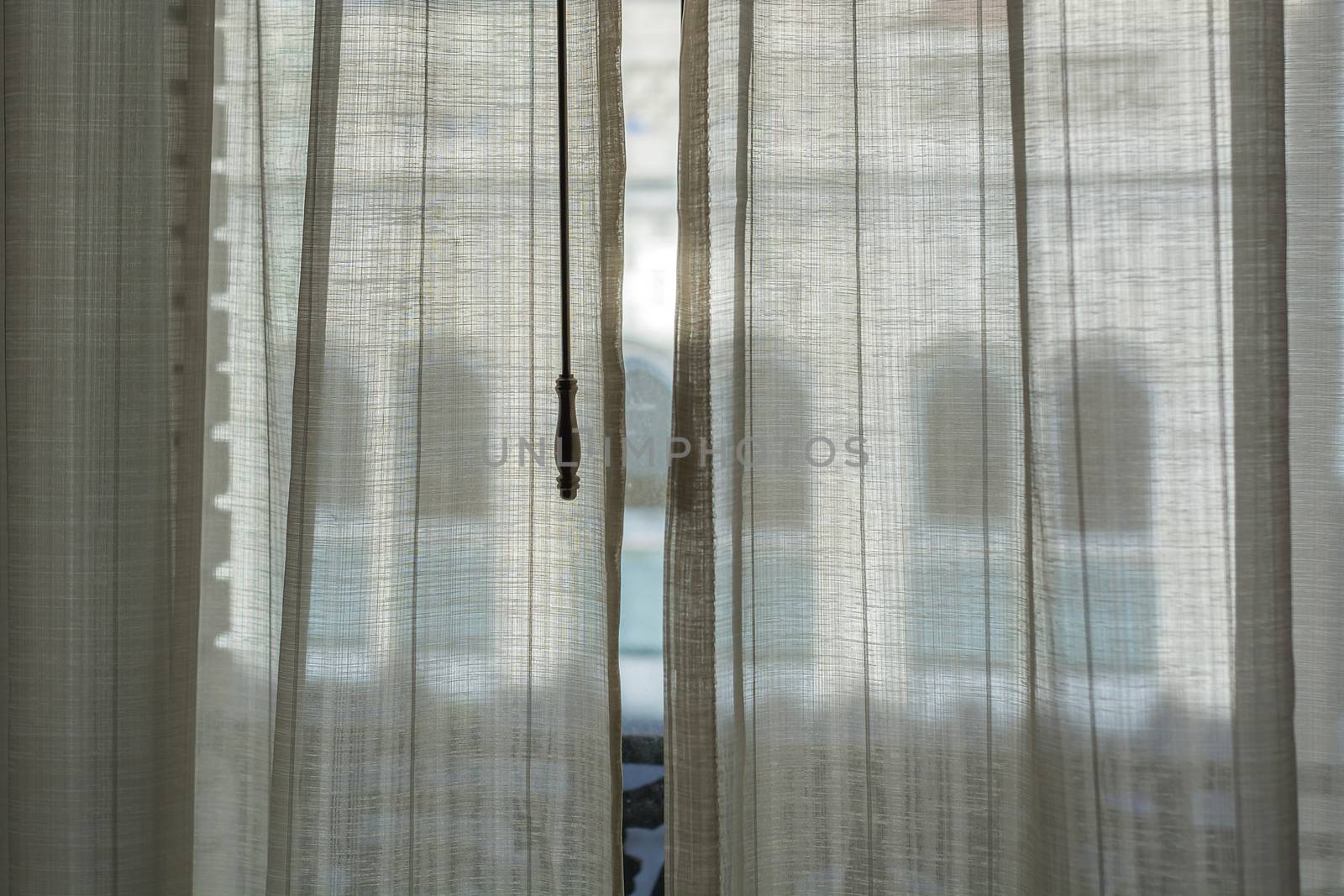 view through white curtains