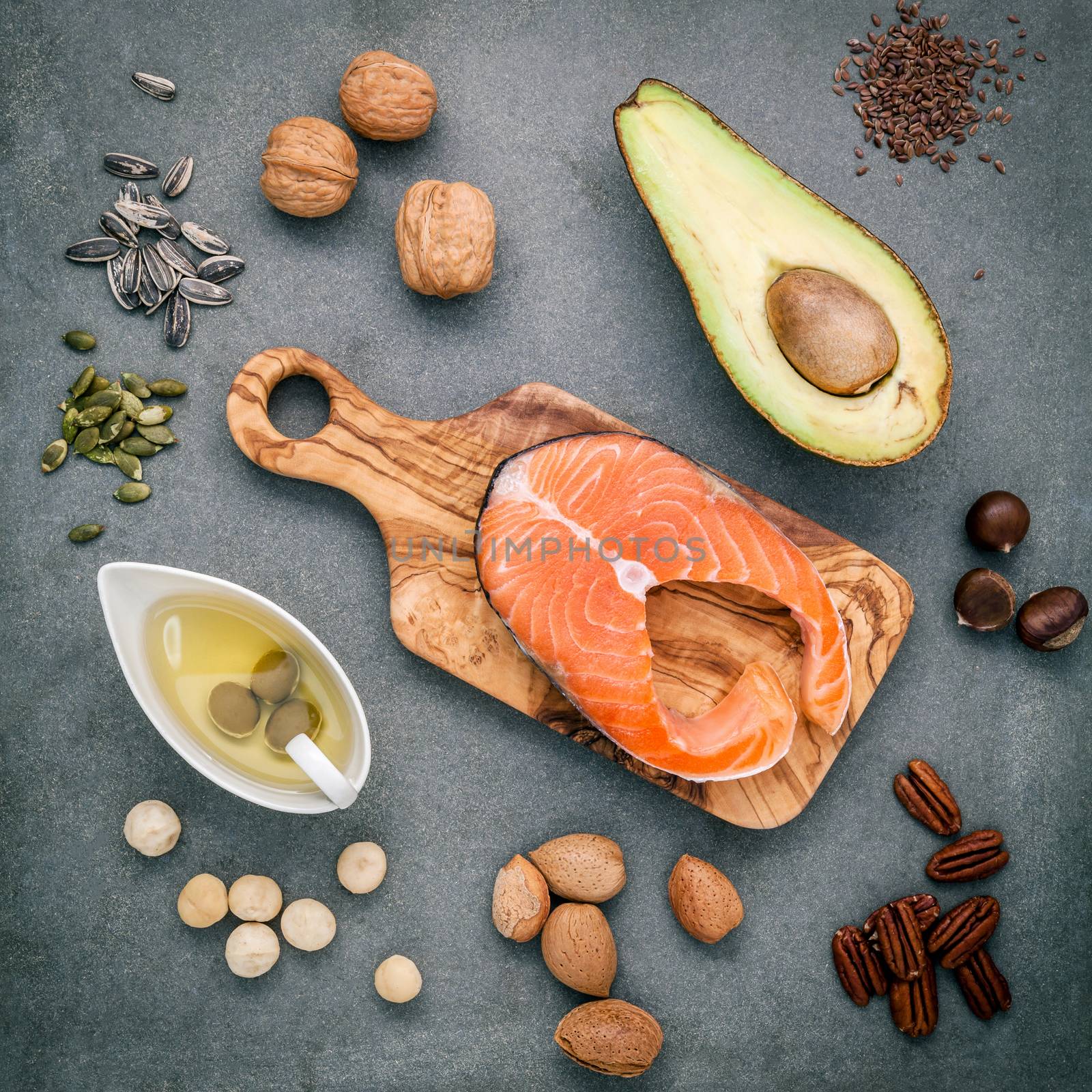 Selection food sources of omega 3 and unsaturated fats. Super food high omega 3 and unsaturated fats for healthy food. Almond ,pecan ,hazelnuts,walnuts ,olive oil ,fish oil ,salmon and avocado .