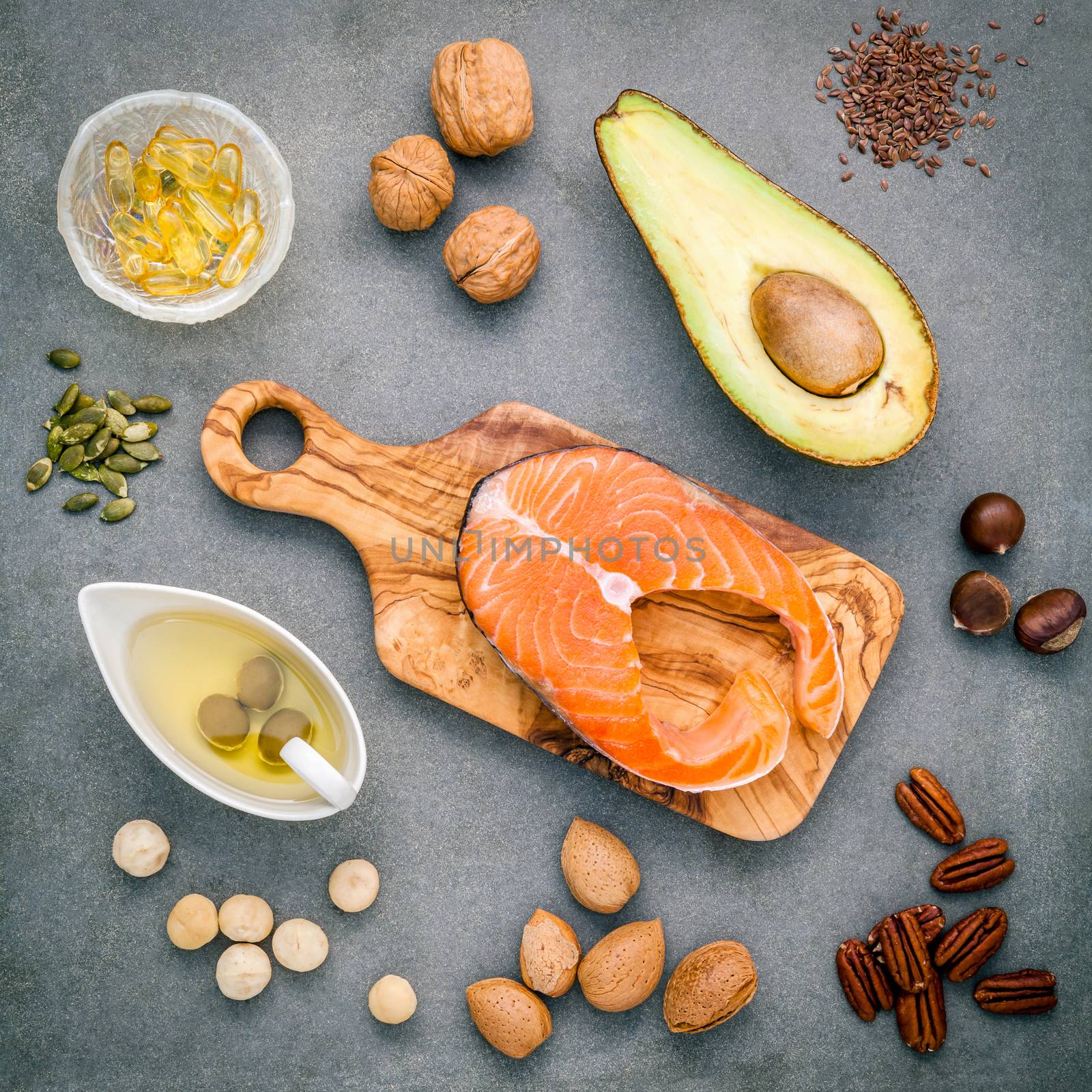 Selection food sources of omega 3 and unsaturated fats. Super food high omega 3 and unsaturated fats for healthy food. Almond ,pecan ,hazelnuts,walnuts ,olive oil ,fish oil ,salmon and avocado .
