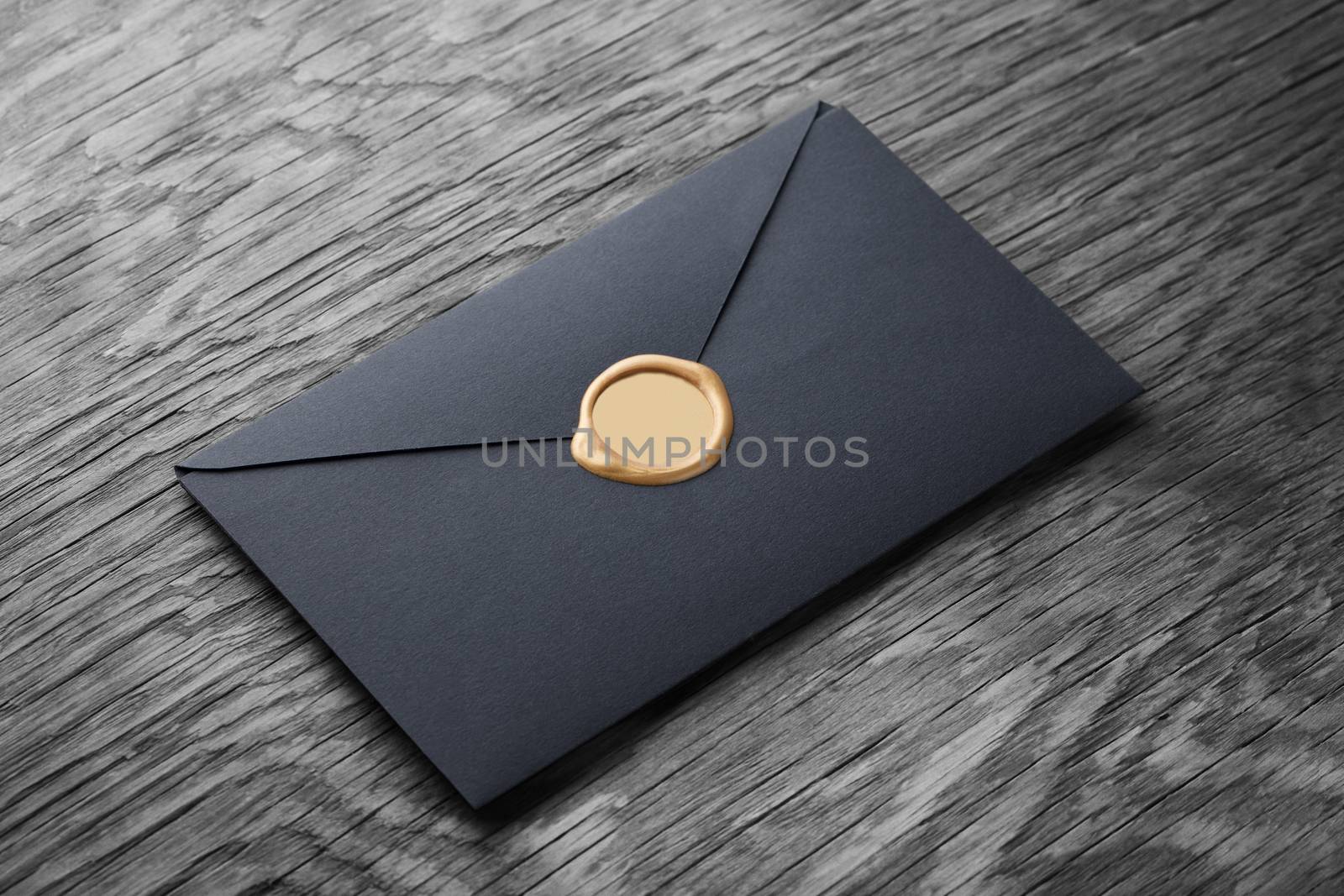 envelope with stamp on the wooden table