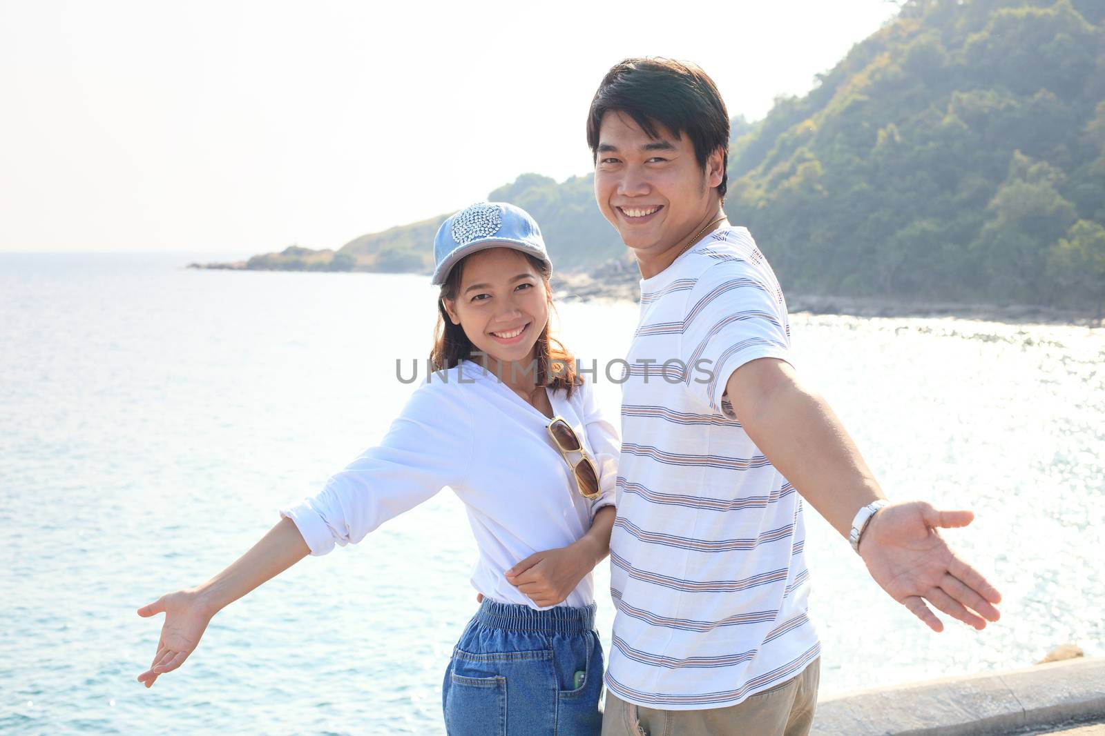 portrait of young man and woman relaxing and happy emotion on sea side use for people relax and feel free on vacation go to beautiful nature destination