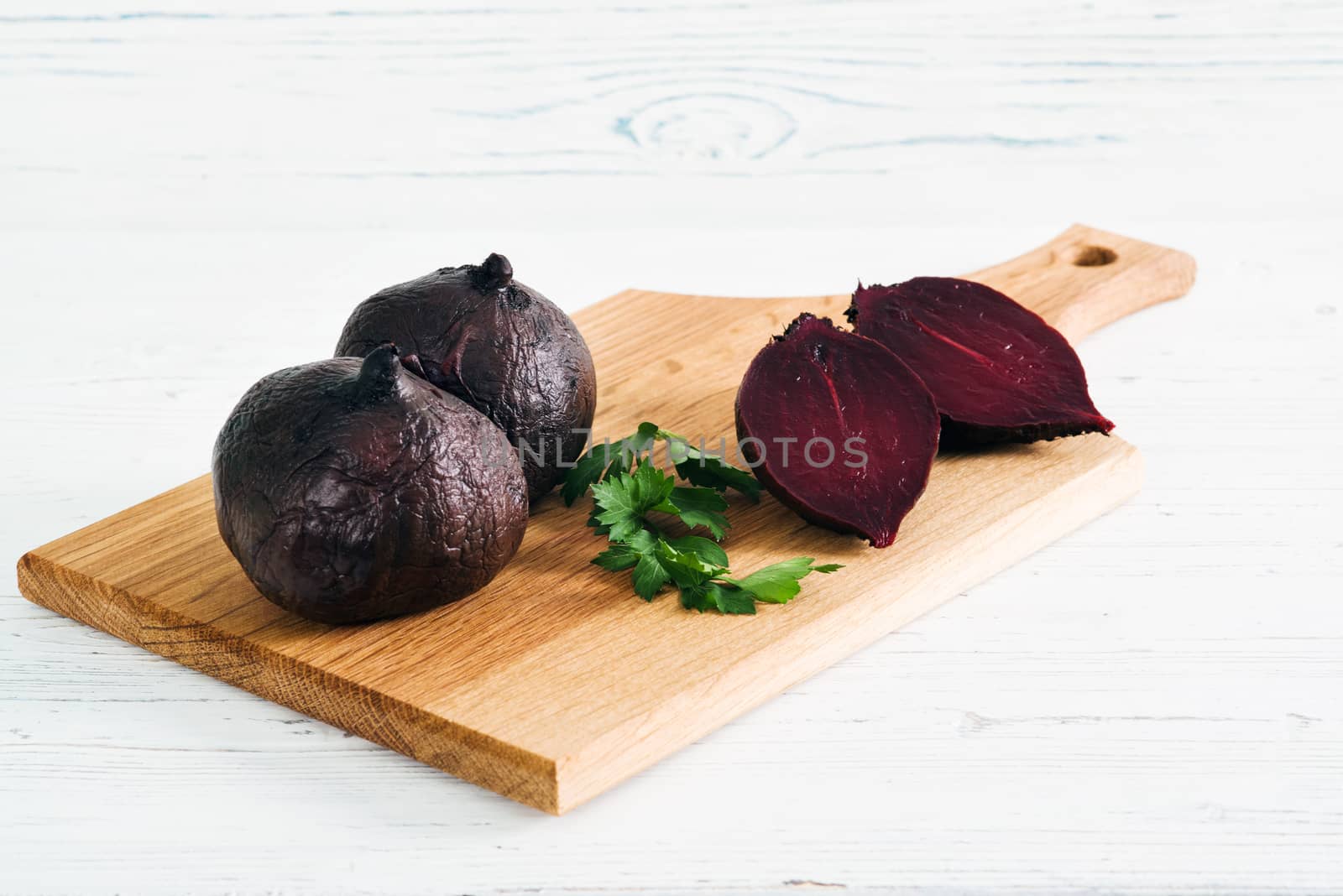 Boiled beets with parsley on board by kzen