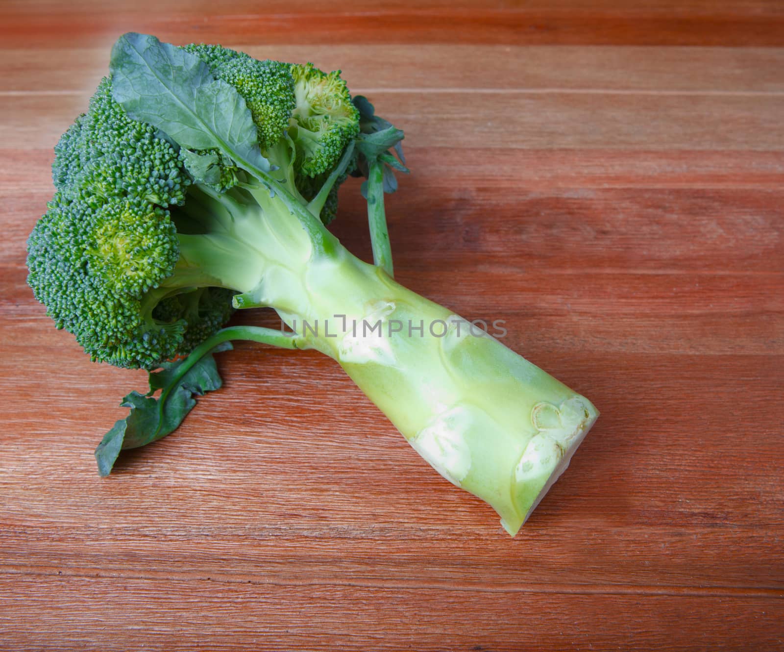 broccoli on top wood table  by khunaspix