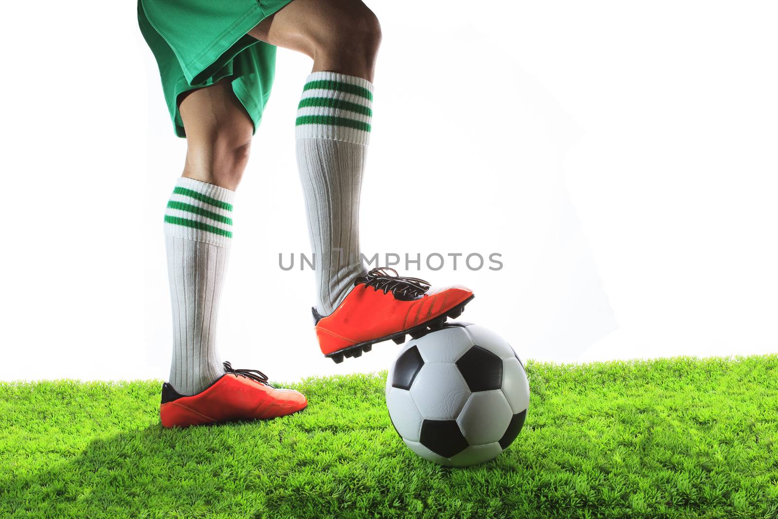 legs of football player ,soccer player and soccer ball isolated white background with copy space use for sport and athletic topic