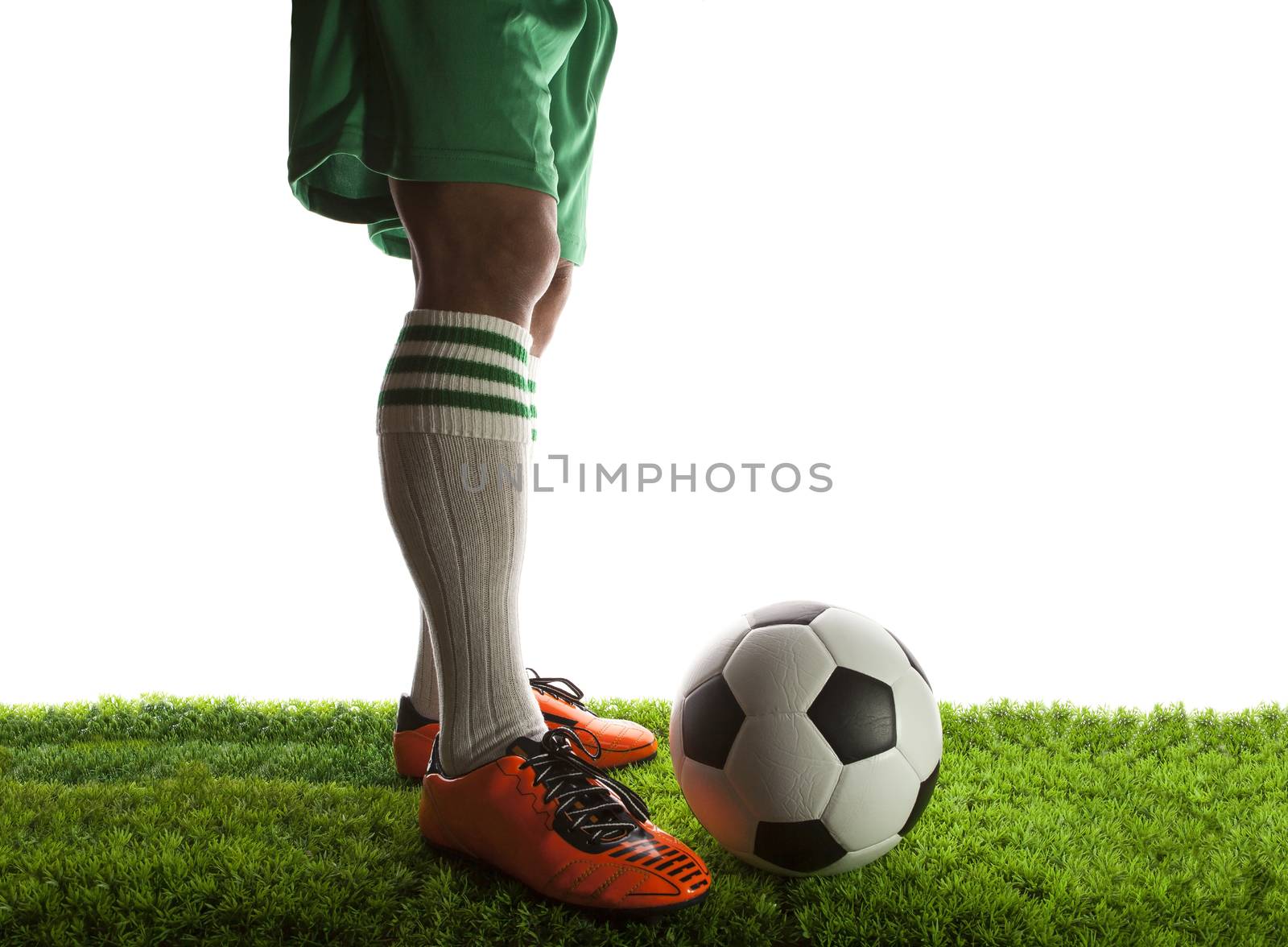 legs of football player ,soccer player and soccer ball isolated white background with copy space use for sport and athletic topic 