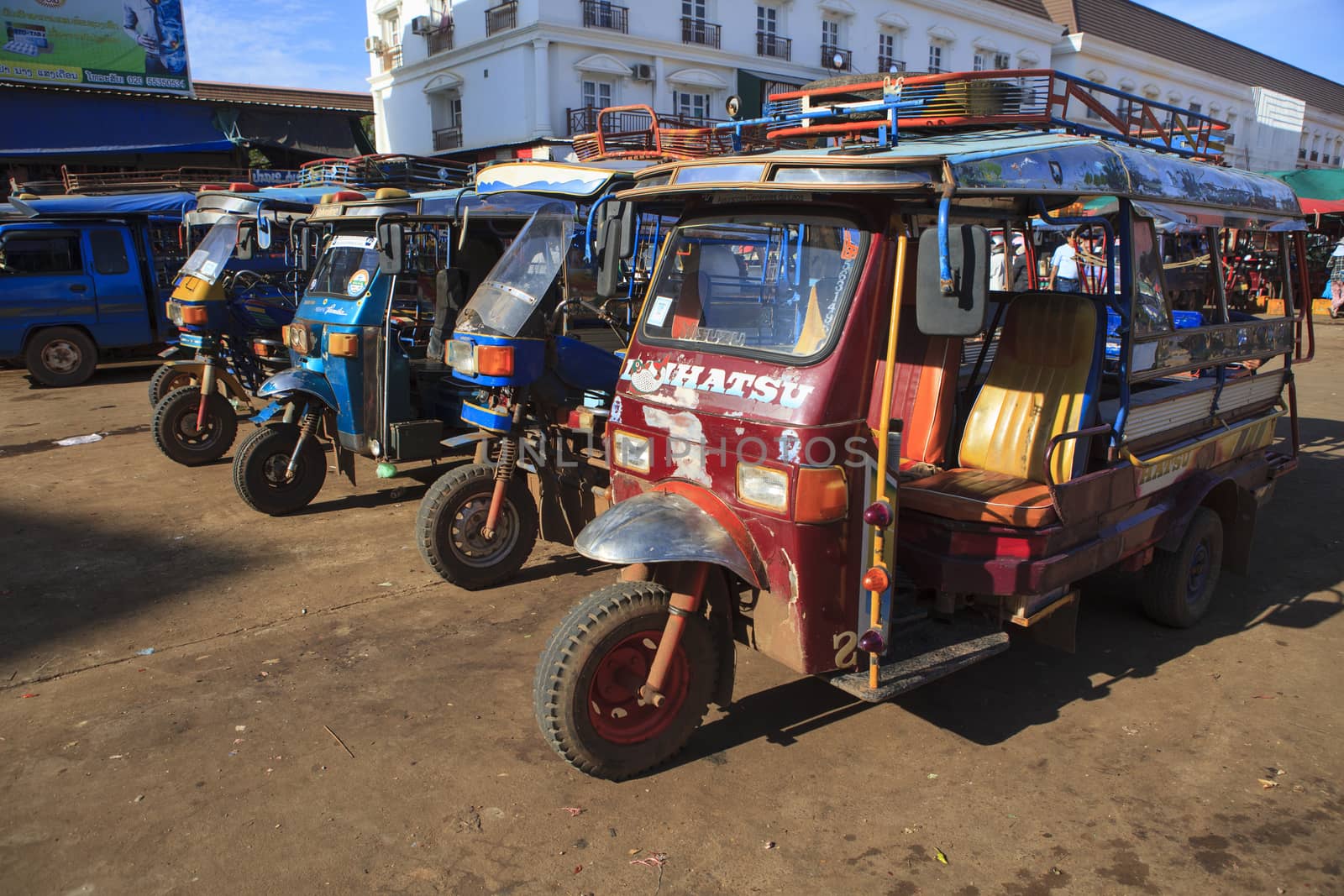 Champasak Laos - Nov23- group of three wheel vehicle queue  in D by khunaspix