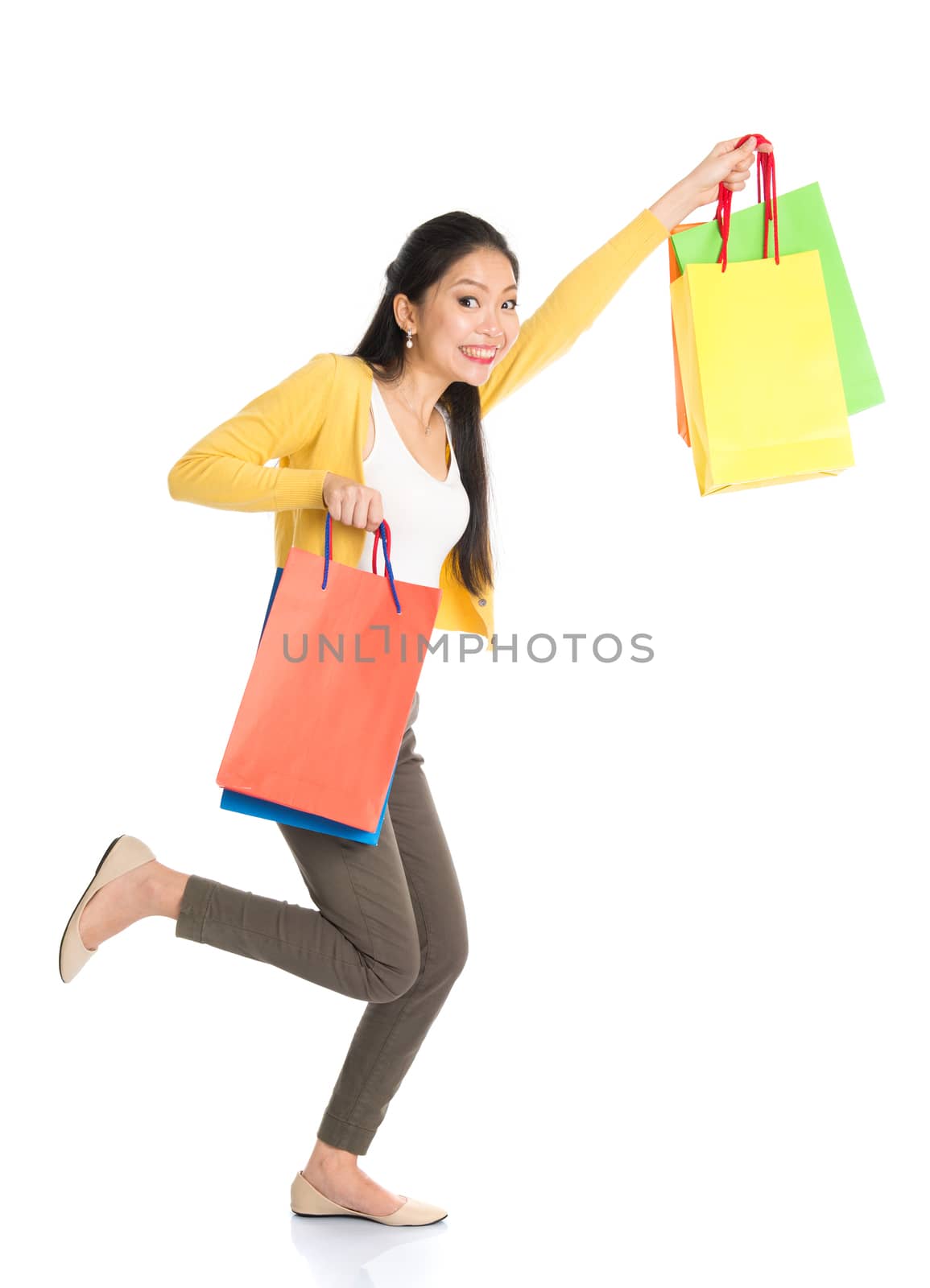 Asian woman with shopping bags by szefei