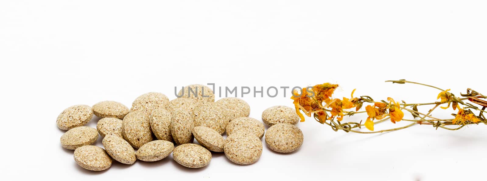 picture of a Perforate St Johns-Wort Flowers and Herbal pills on White Background