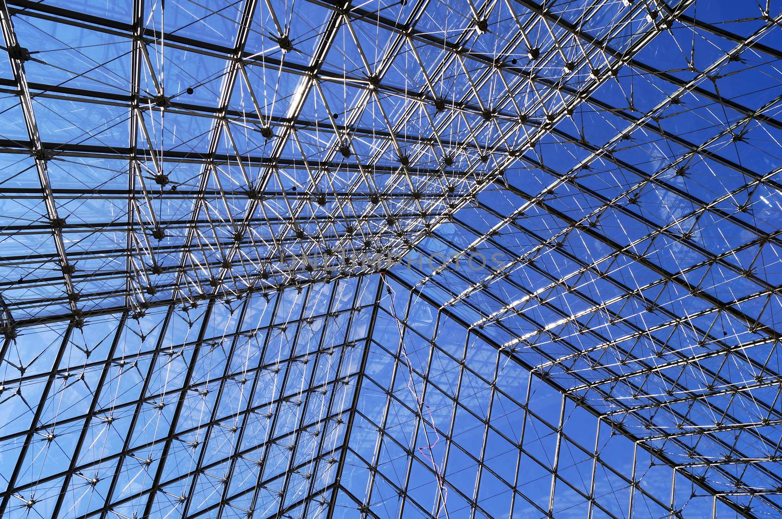 PARIS, FRANCE - SEPTEMBER 28, 2015: Glass pyramid at the Louvre, the world's largest museum in Paris, France 