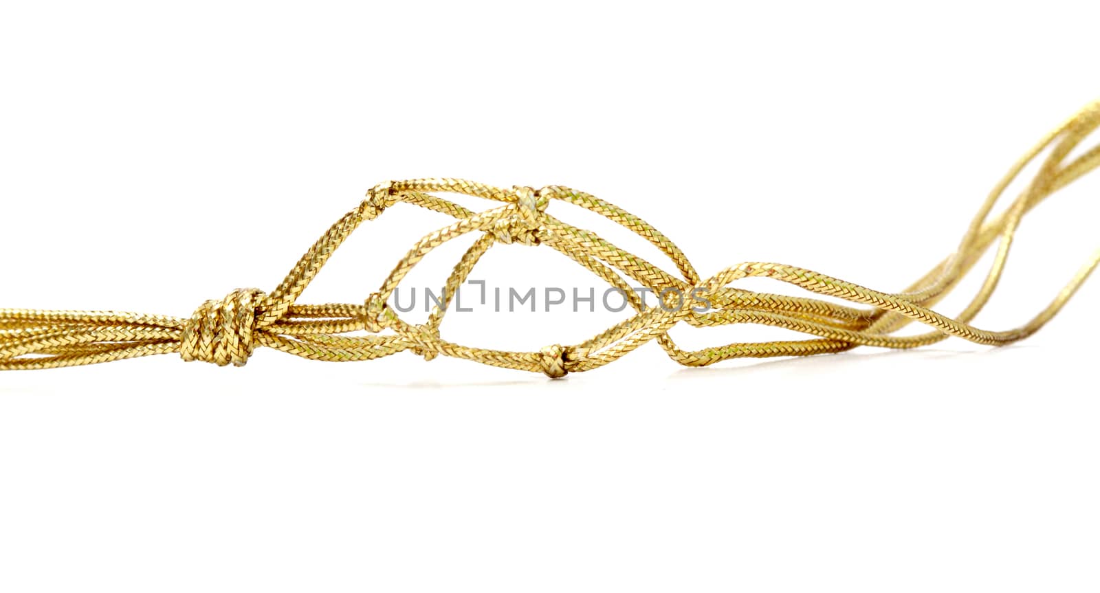 picture of a gold colored rope on white