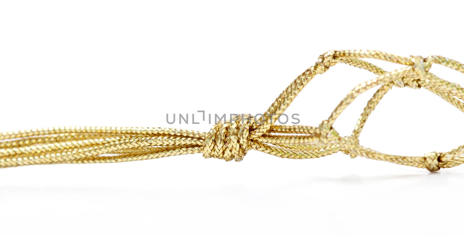 picture of a gold colored rope on white