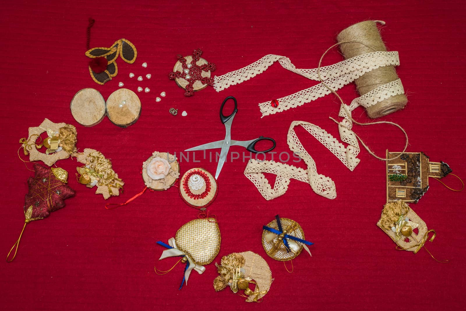 handmade Christmas decorations and toys on a red background