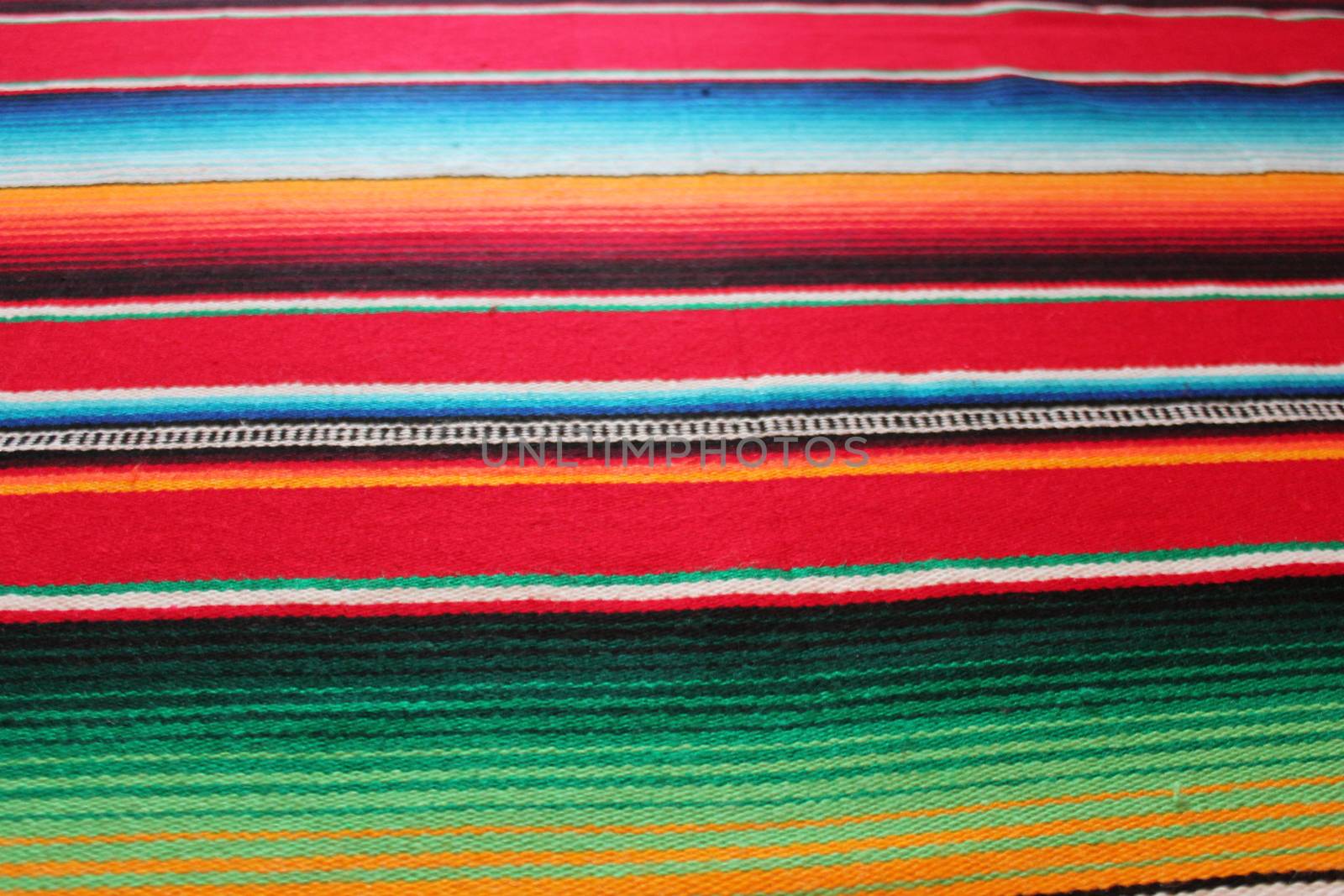 Mexico traditional cinco de mayo rug poncho fiesta background with stripes copy space