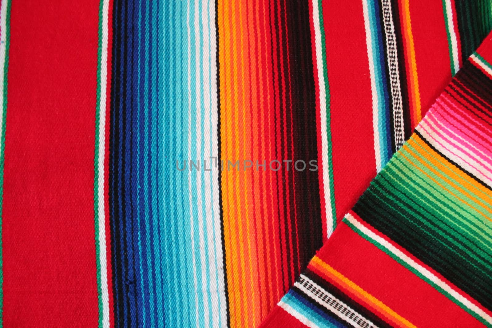 Mexico traditional cinco de mayo rug poncho fiesta background with stripes copy space