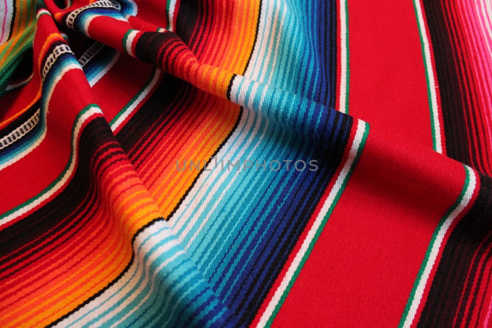 Mexico traditional cinco de mayo rug poncho fiesta background with stripes copy space