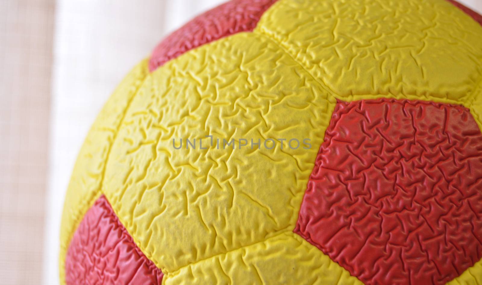 picture of a Red and yellow Soccer Ball macro, texture