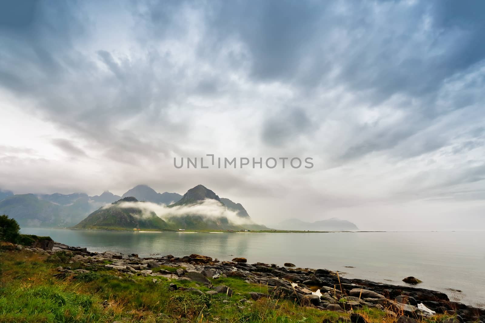 Norway lofoten islands in clouds of fog. Cloudy Nordic day.