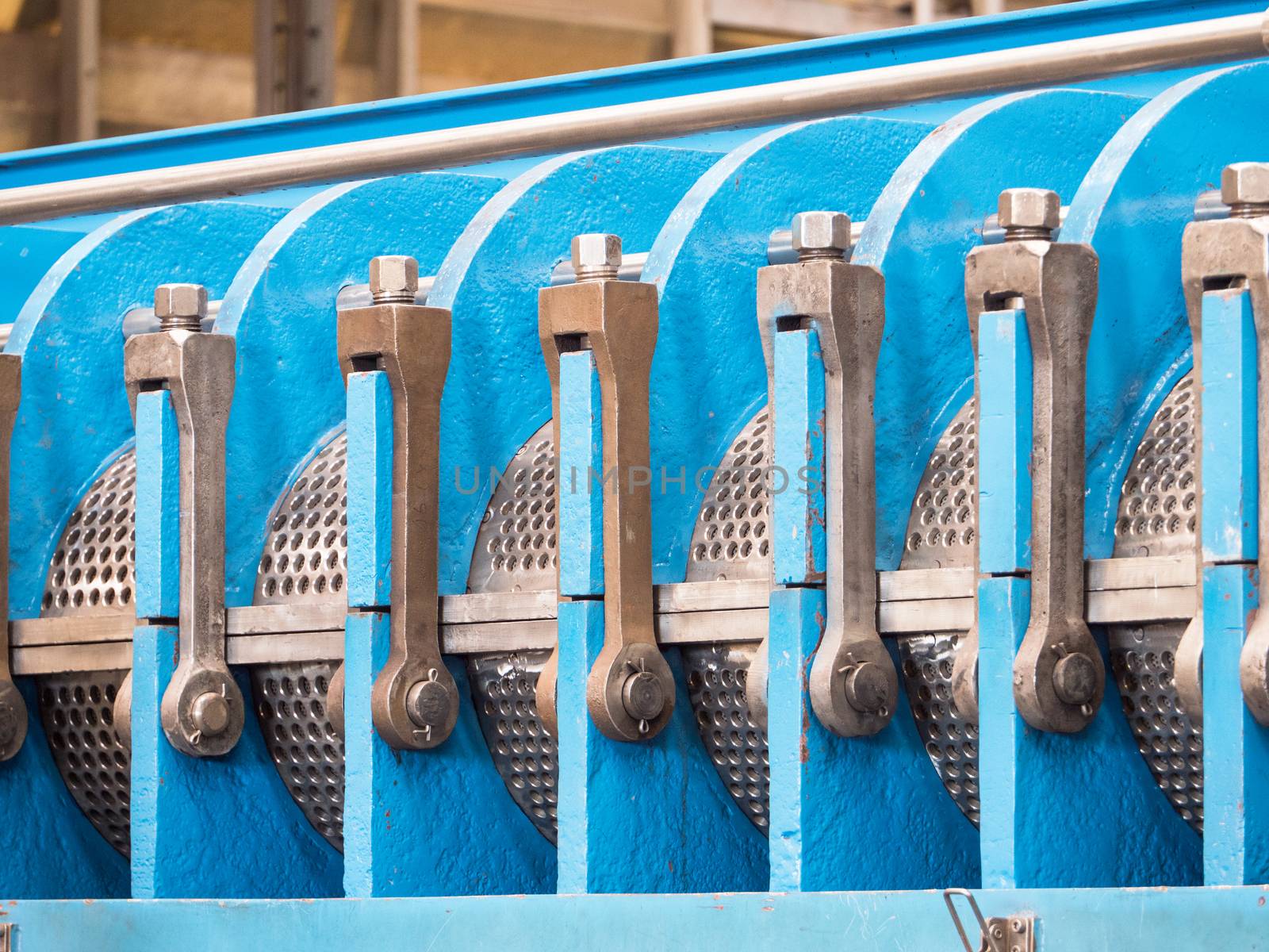 Detail photo of twin screw industrial press for processing, of food byproducts.