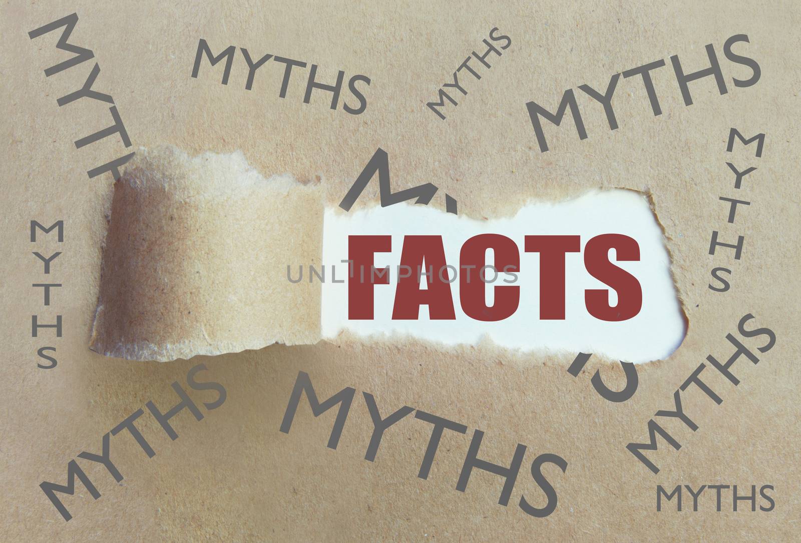 Torn brown paper revealing the word facts surrounded by myths 