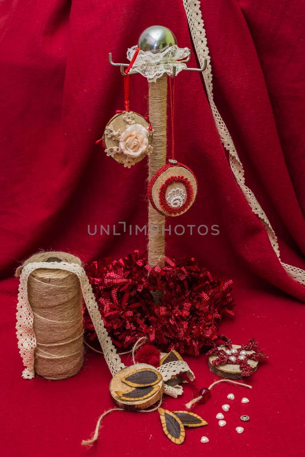 handmade Christmas decorations and toys on a red background