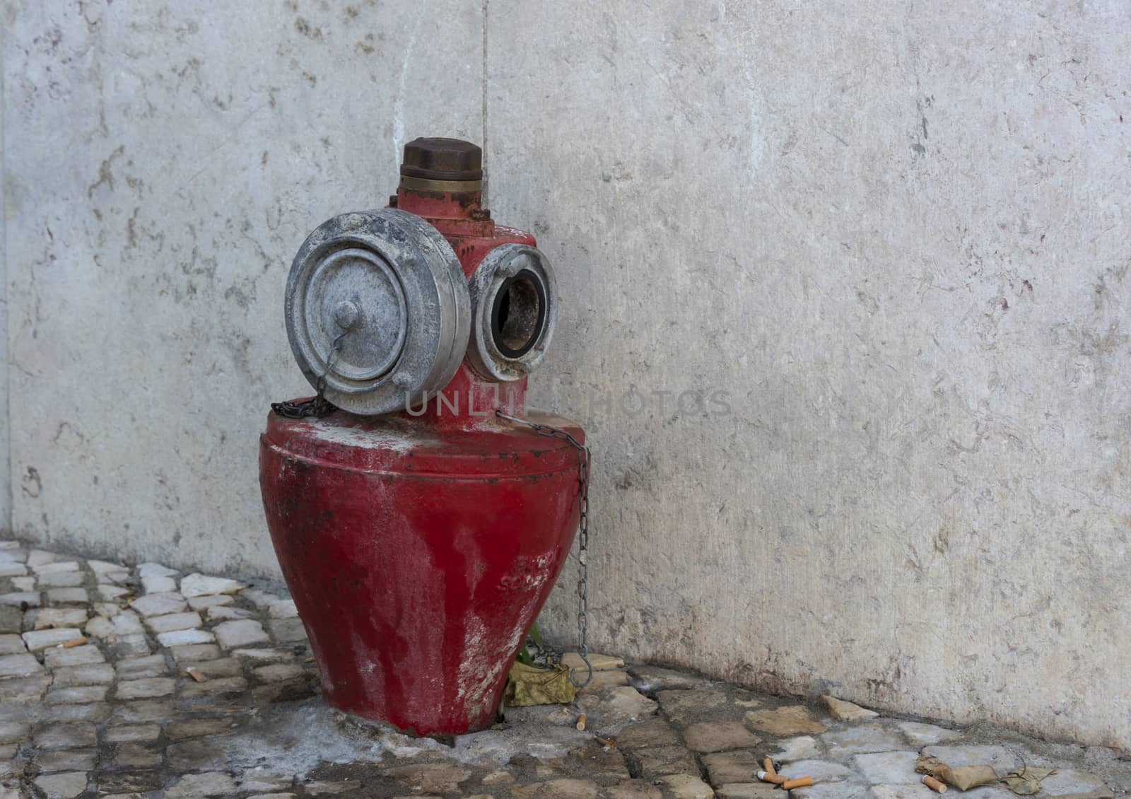 old red fire water hydrant in the city of Lisbon, the capital of Portugal
