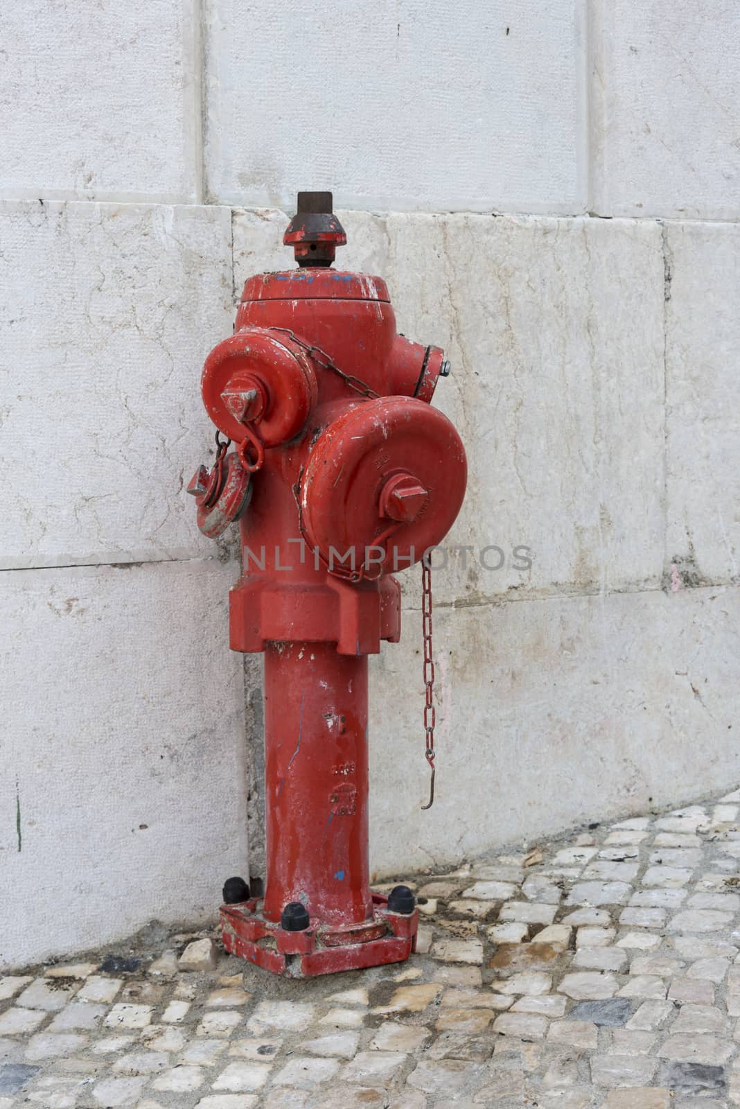 old red fire water hydrant in the city of Lisbon, the capital of Portugal