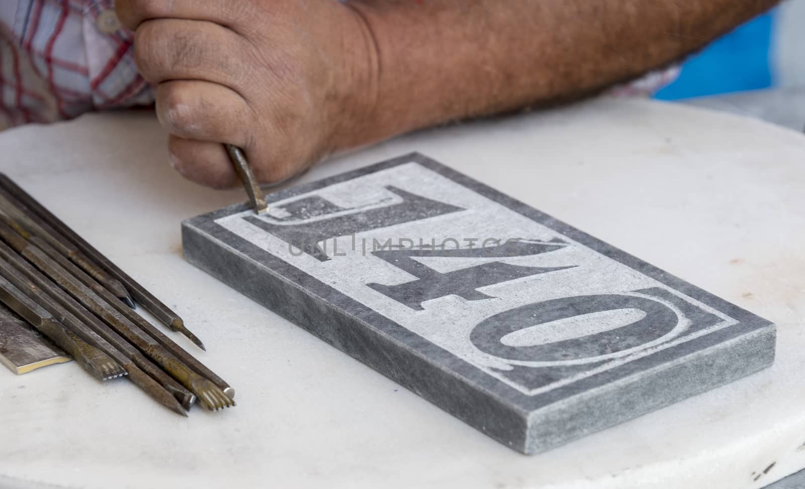 stonecutter making art from raw stone