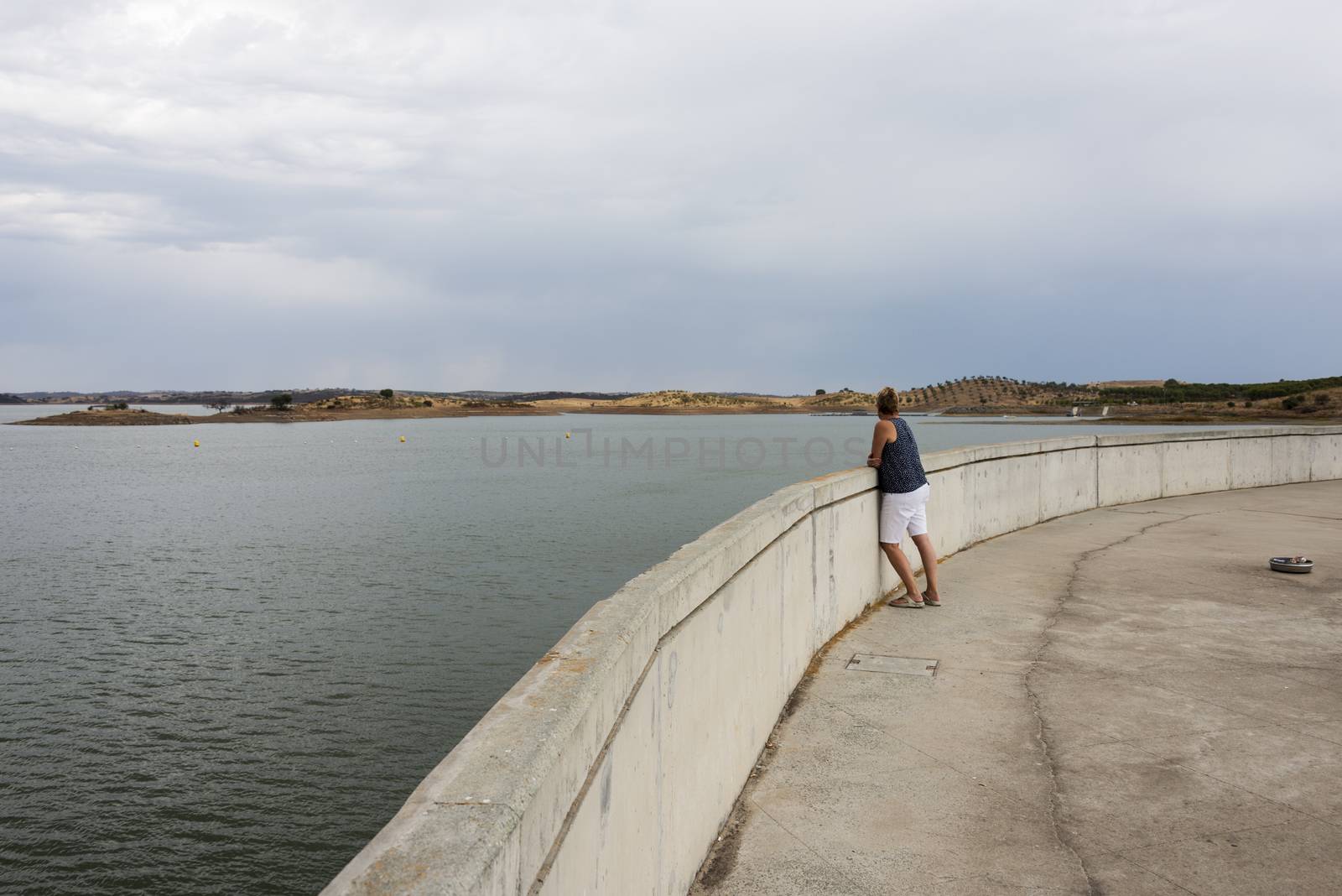 woman looking at the big lake, the albufeir do alquava in Portugal